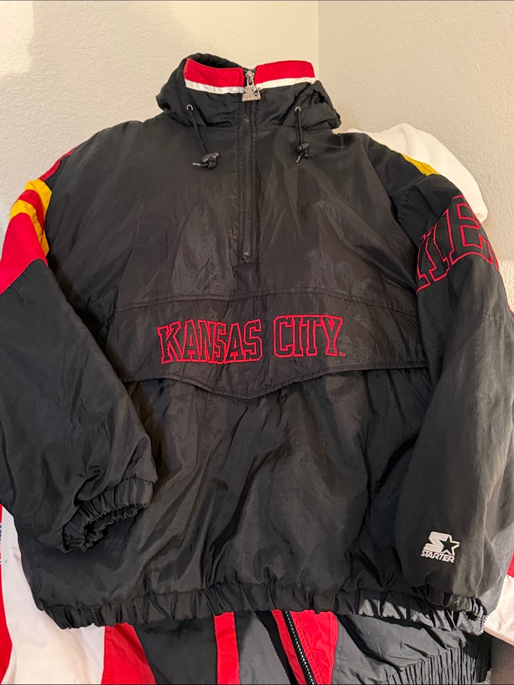 STARTER Black Pullover Jacket with Red & Yellow Accents